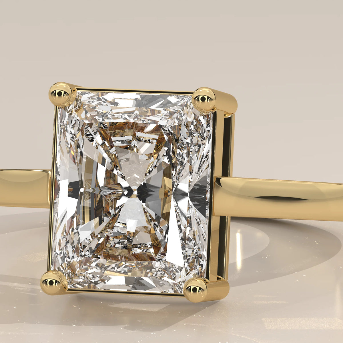 Nachel 5 Carat Radiant Lab Grown Diamond Solitaire Ring, Plain Band in yellow gold, photographed from the side.