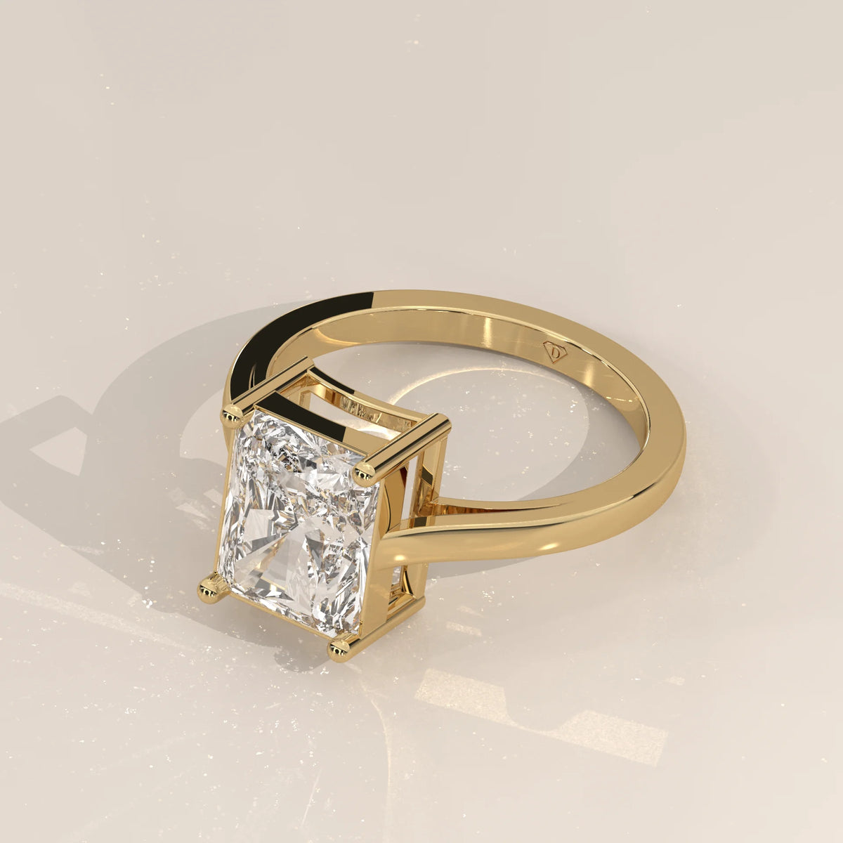 Nachel 5 Carat Radiant Lab Grown Diamond Solitaire Ring, Plain Band in yellow gold, shown from the side.