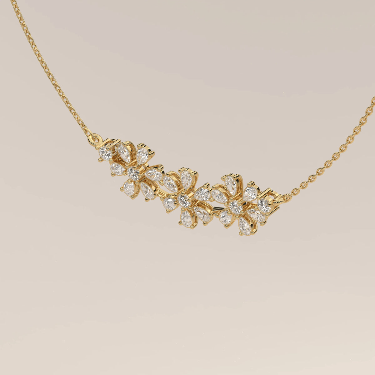 A floral lab grown diamond cluster pendant bar design in yellow gold, photographed head-on.