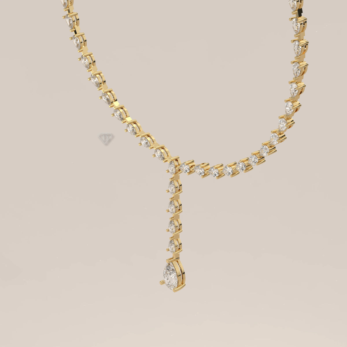 A pear shape lab grown diamond drop necklace in yellow gold, photographed head-on.