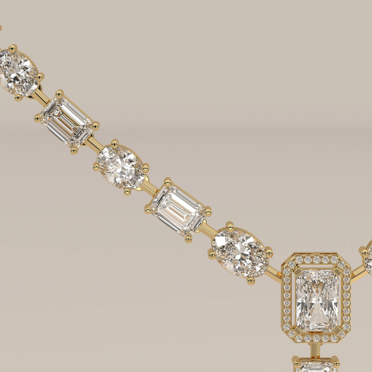 An emerald cut halo y-drop lab grown diamond necklace in yellow gold, viewed from overhead.