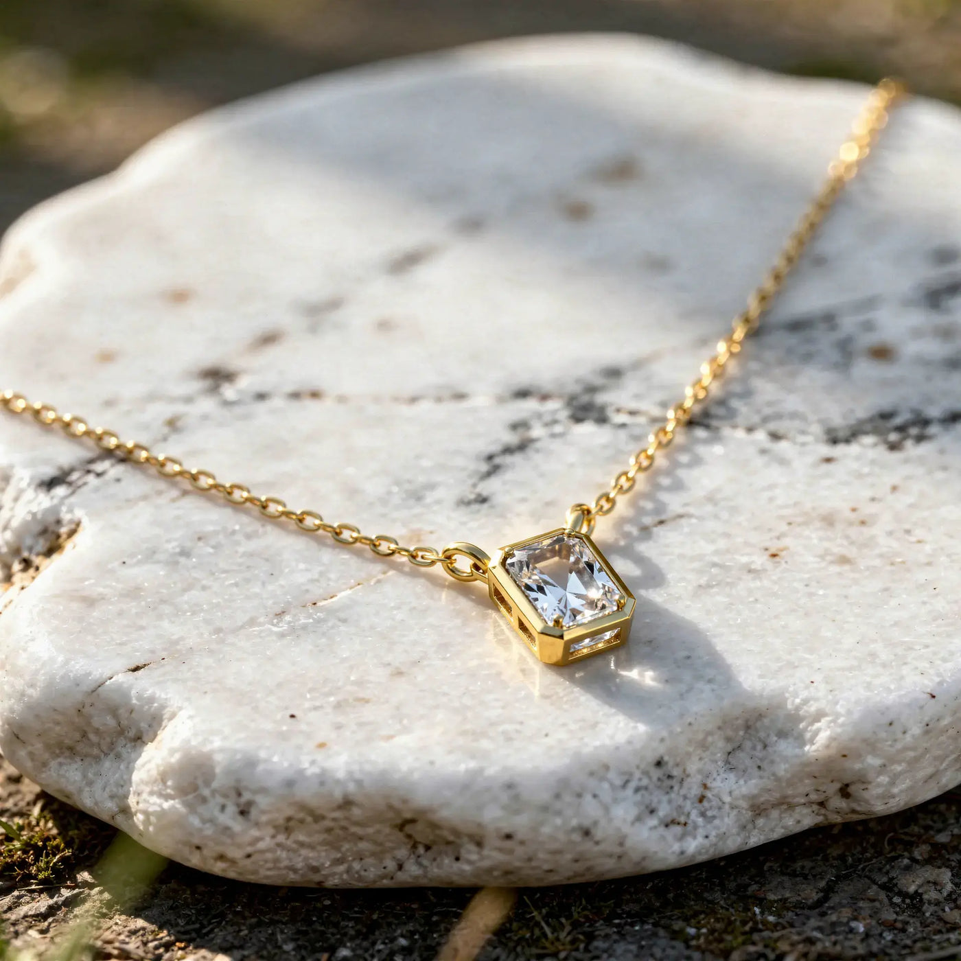 Close-up: Emerald Cut Diamond Necklace with Bezel Setting in 14k Gold - Lab Grown - Driona Jewels