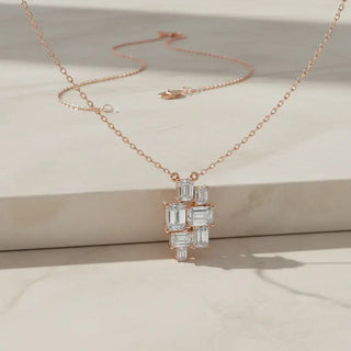 Flat Lay: Emerald Cut Diamond Necklace with Cluster Setting in 14k Rose Gold - Lab Grown - Driona Jewels
