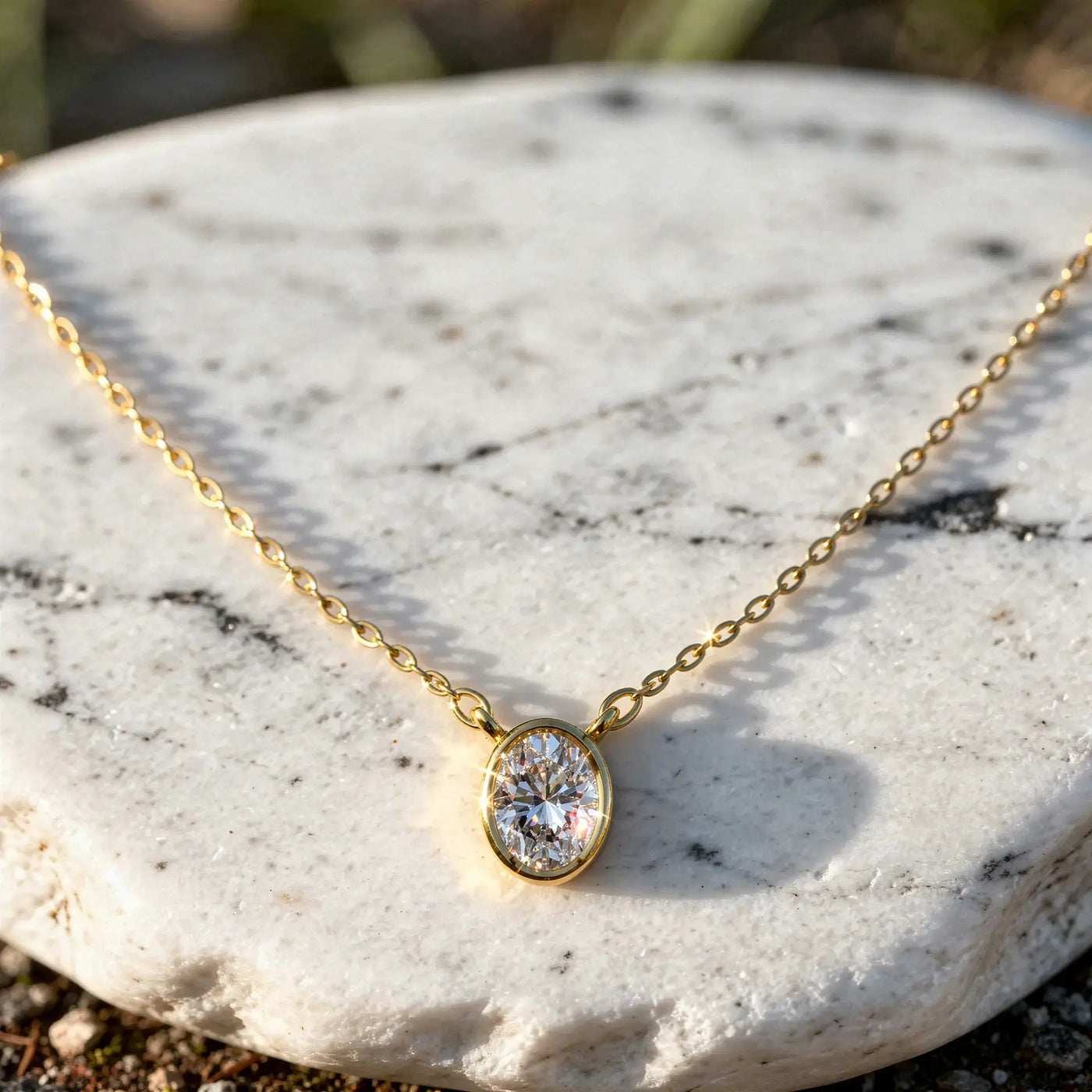 Close-up: Oval Diamond Necklace with Bezel Setting in 14k Yellow Gold - Lab Grown - Driona Jewels