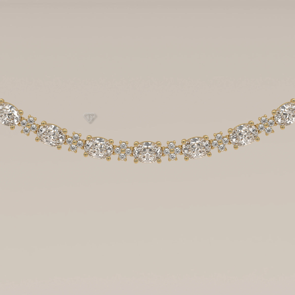 A graduated oval lab grown diamond necklace in yellow gold, photographed head-on.