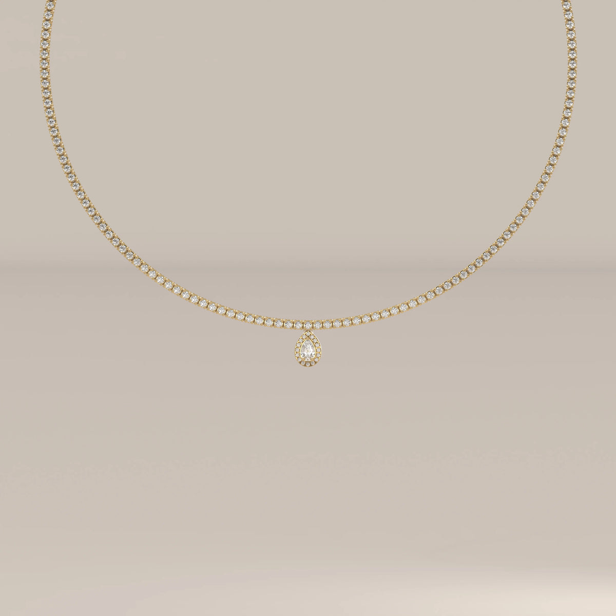 A pear halo lab grown diamond teardrop tennis necklace in yellow gold, shown from the front.