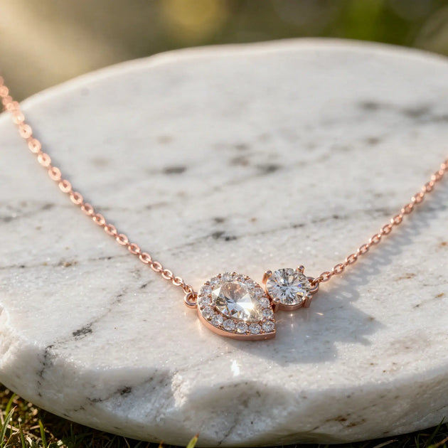 Flat Lay: Pear Cut Diamond Necklace with Halo Setting in 14k Rose Gold - Lab Grown - Driona Jewels
