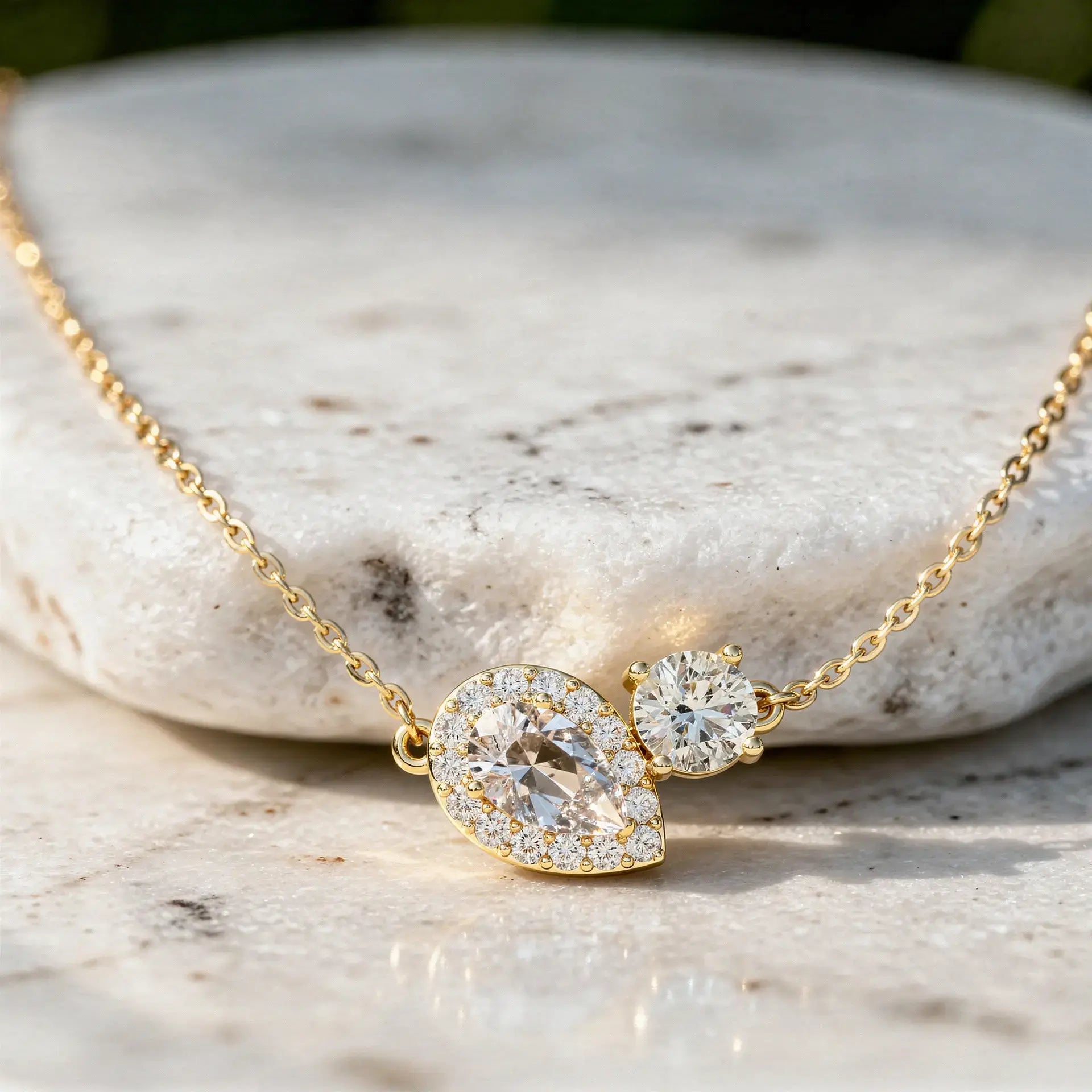 Close-up: Pear Diamond Necklace with Halo Setting in 14k Yellow Gold - Lab Grown - Driona Jewels
