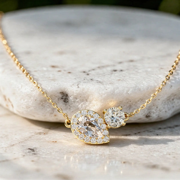 Close-up: Pear Diamond Necklace with Halo Setting in 14k Yellow Gold - Lab Grown - Driona Jewels