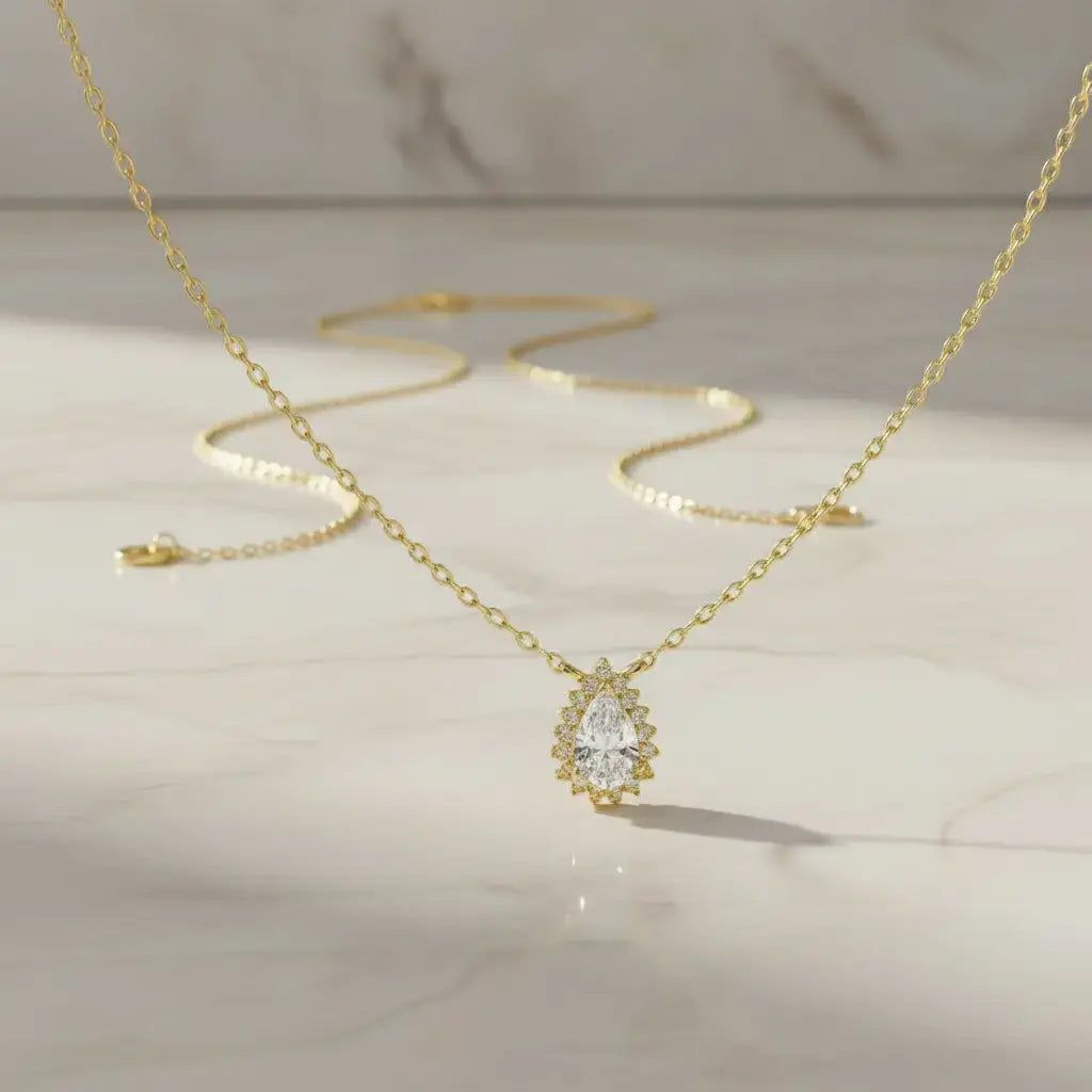 Flat Lay: Pear Cut Diamond Necklace with Halo Setting in 14k Yellow Gold - Lab Grown - Driona Jewels