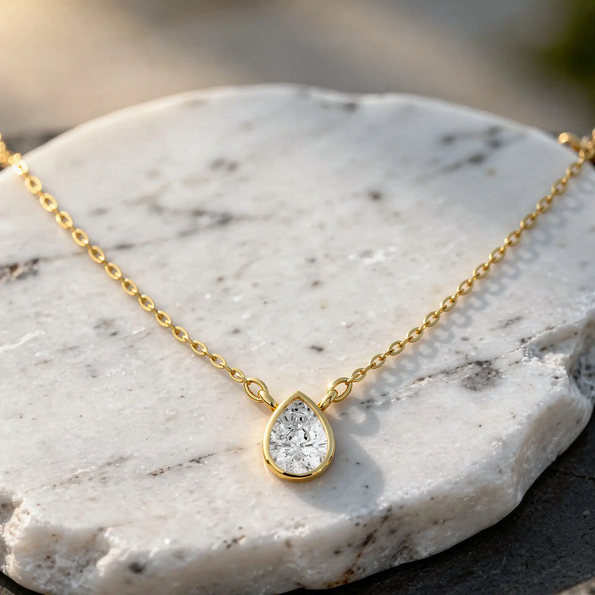 Flat Lay: Pear Diamond Necklace with Prong Setting in 14k Yellow Gold - Lab Grown - Driona Jewels