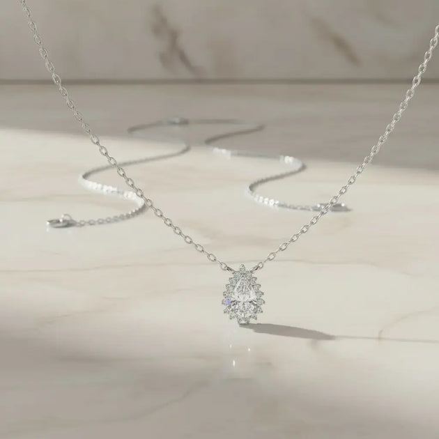 Flat Lay: Pear Cut Diamond Necklace with Solitaire Setting in 14k White Gold - Lab Grown - Driona Jewels