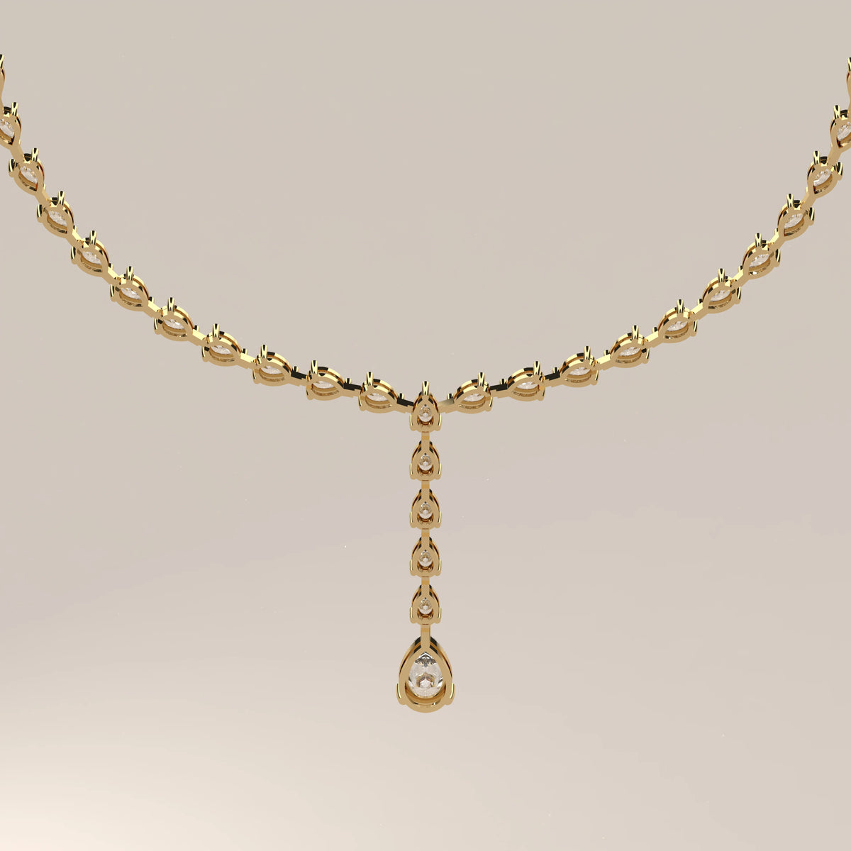 A pear shape lab grown diamond drop necklace in yellow gold, front view on a plain background.