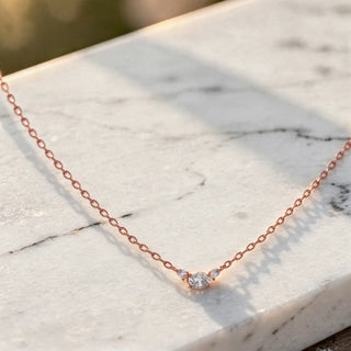 Flat Lay: Round Diamond Necklace with Bezel Setting in 14k Rose Gold - Lab Grown - Driona Jewels