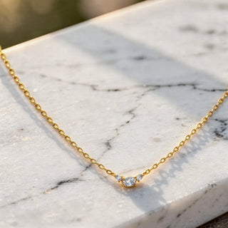 Flat Lay: Round Diamond Necklace with Bezel Setting in 14k Yellow Gold - Lab Grown - Driona Jewels