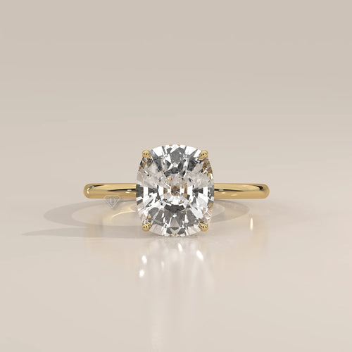 Nemma 5 Carat Cushion Lab Grown Diamond Solitaire, Hidden Halo in yellow gold, photographed head-on.