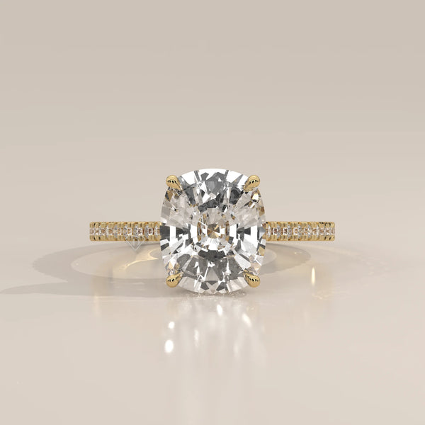 Olive 5 Carat Cushion Lab Grown Diamond Ring, Hidden Halo Pave Band in yellow gold, shown from the front.
