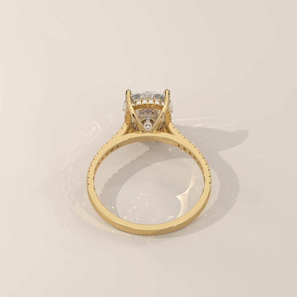 Olive 5 Carat Cushion Lab Grown Diamond Ring, Hidden Halo Pave Band in yellow gold, photographed from the side.