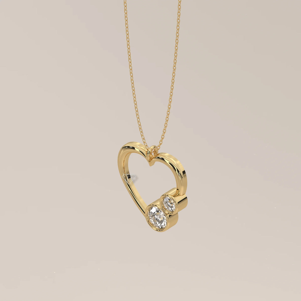 Open Heart Pendant with Two Bezel Round Lab Grown Diamonds in yellow gold, shown at an angle.