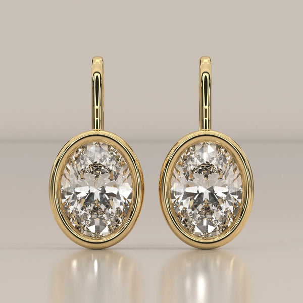 Oval Bezel Set Lab Grown Diamond Drop Earrings on a Gold Hook in yellow gold, shown from the front.