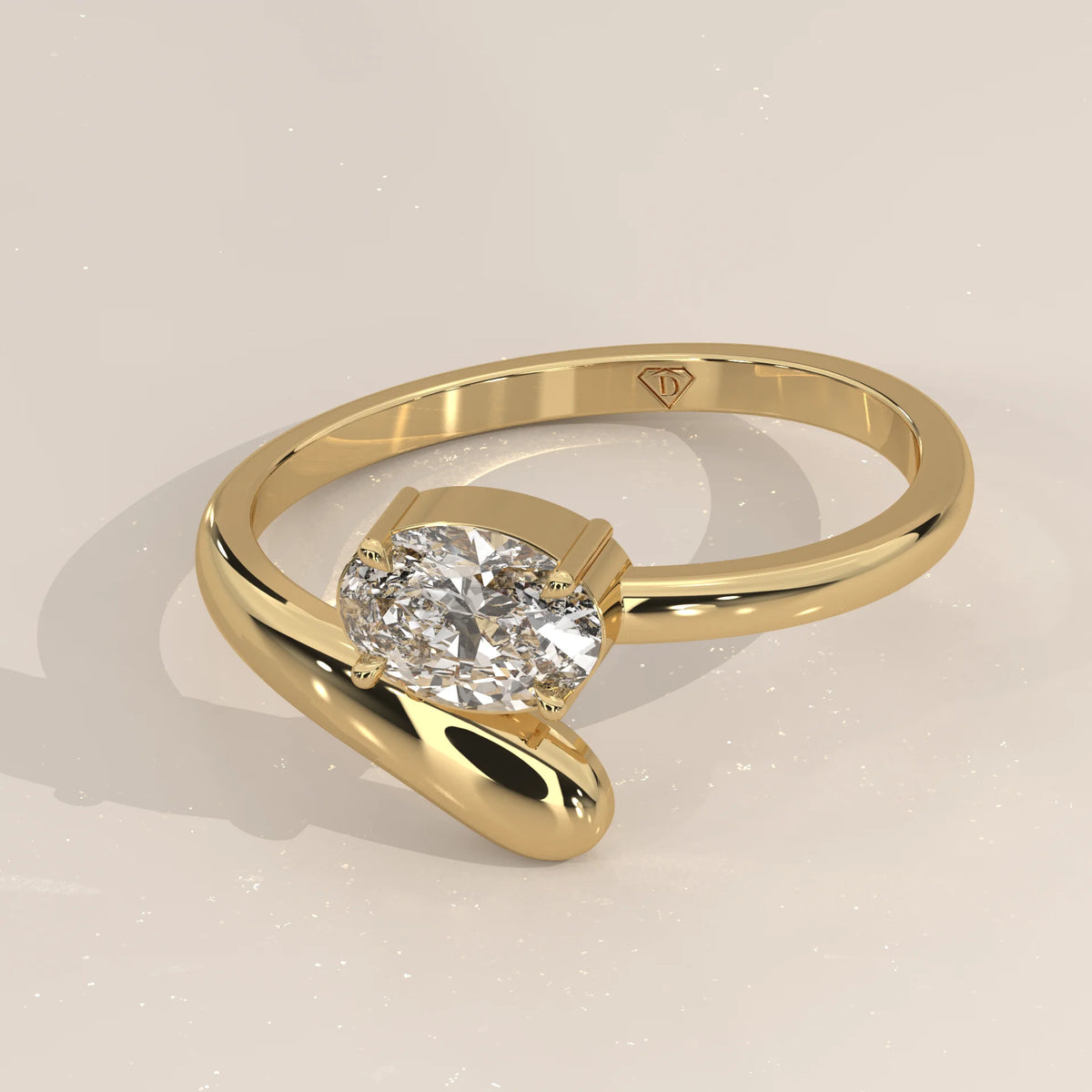 East West Oval Lab Grown Diamond Bypass Ring with Teardrop End in yellow gold, photographed at a three-quarter angle.