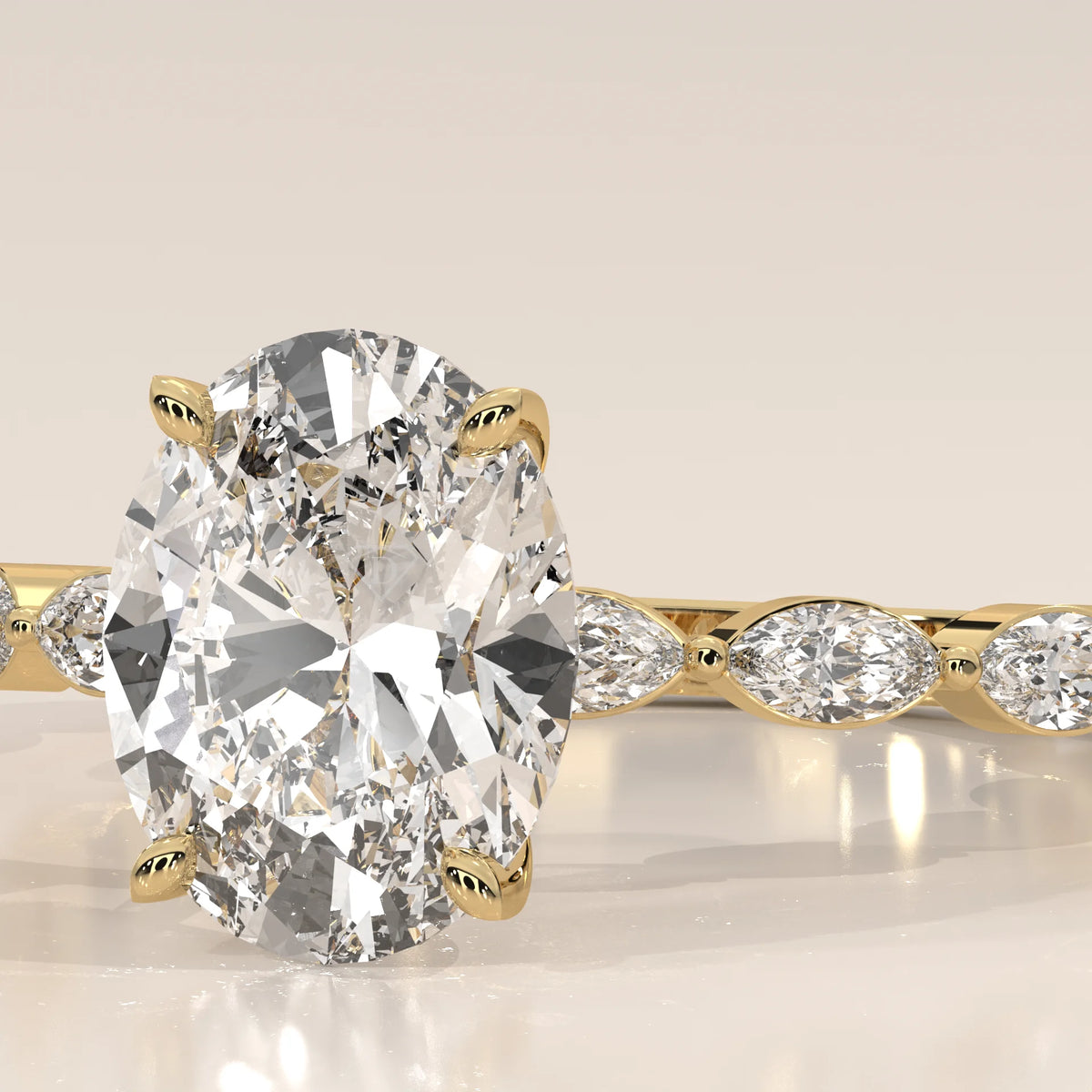 Close-up of a yellow gold ring with a large oval diamond and smaller marquise diamonds.