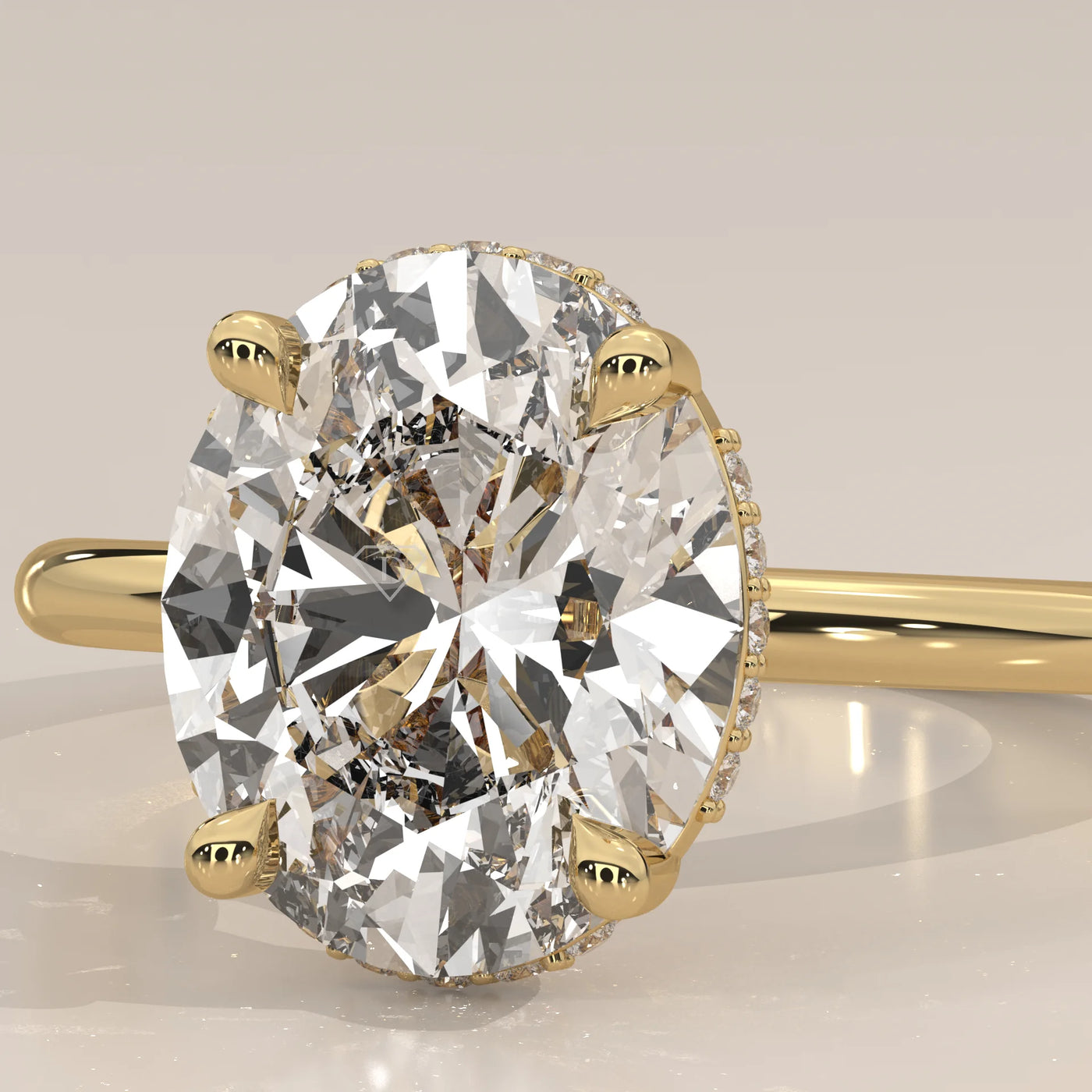 Close-up of an oval diamond engagement ring in yellow gold.