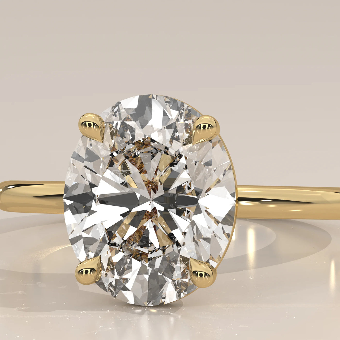 Oval cut diamond engagement ring with a paved band in yellow gold.