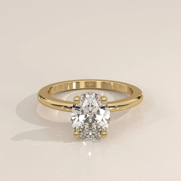 Oval cut diamond engagement ring with accent stones in 14k gold.
