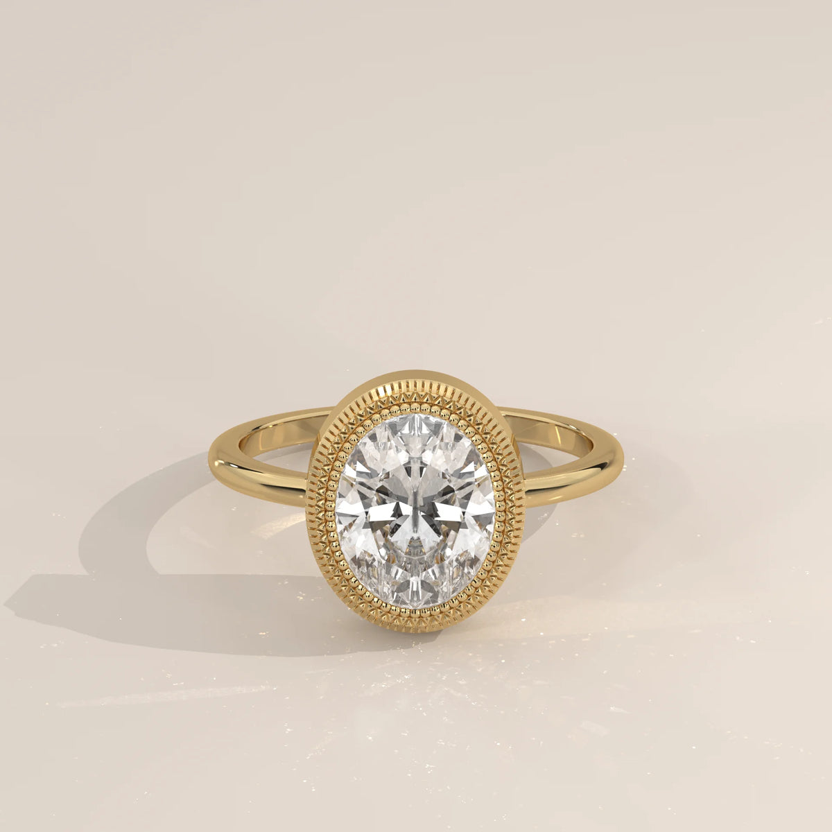 Oval Lab Grown Diamond Bezel Solitaire with Coin Edge Rim in yellow gold, shown from the front.