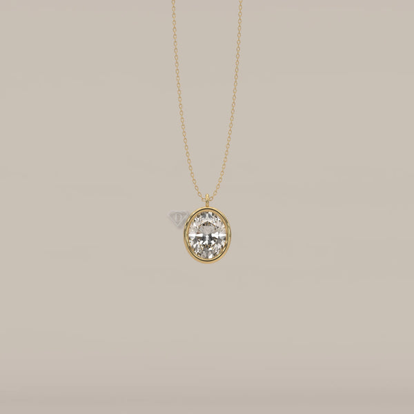 Oval diamond pendant necklace in 14k gold.