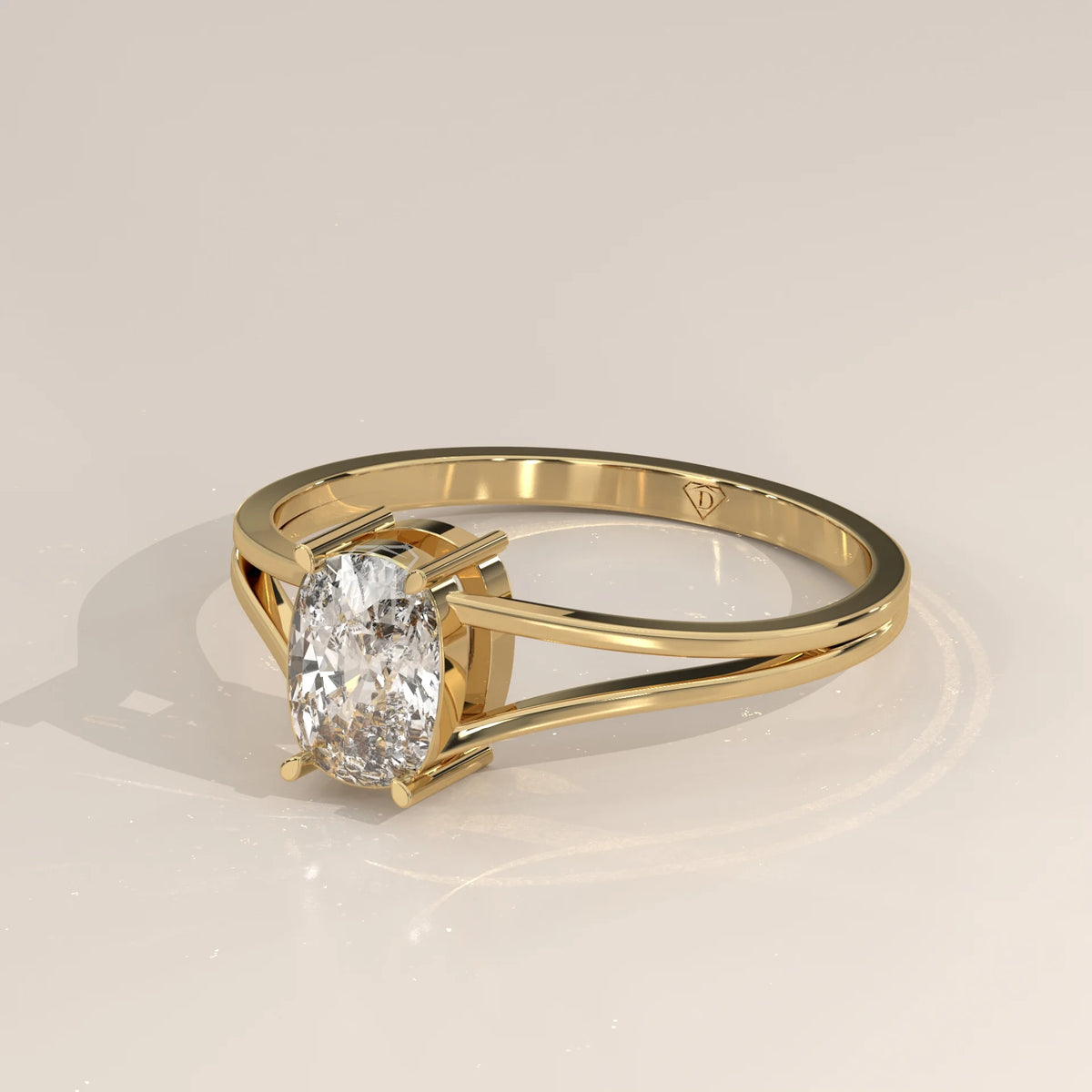Gold ring with an oval-shaped diamond set in a split band.