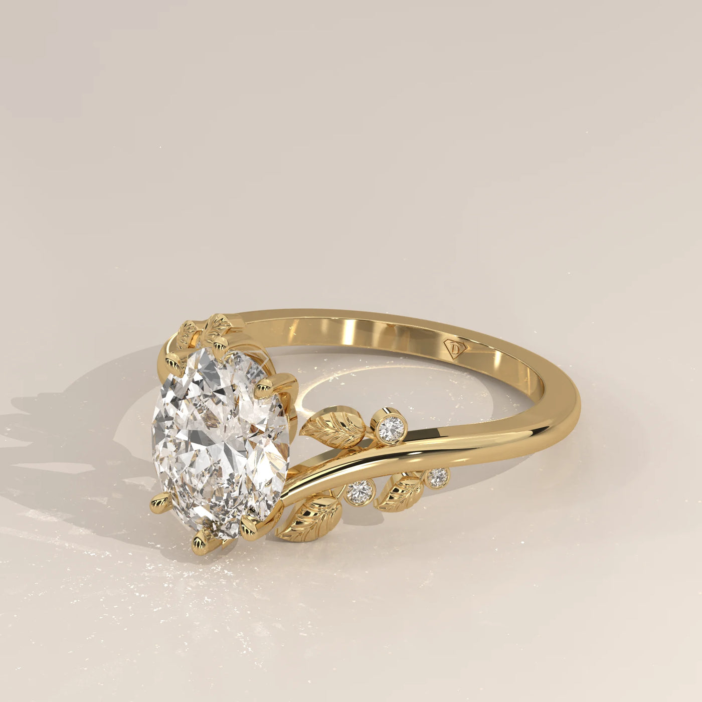 Oval diamond engagement ring with leaf design in 14k gold