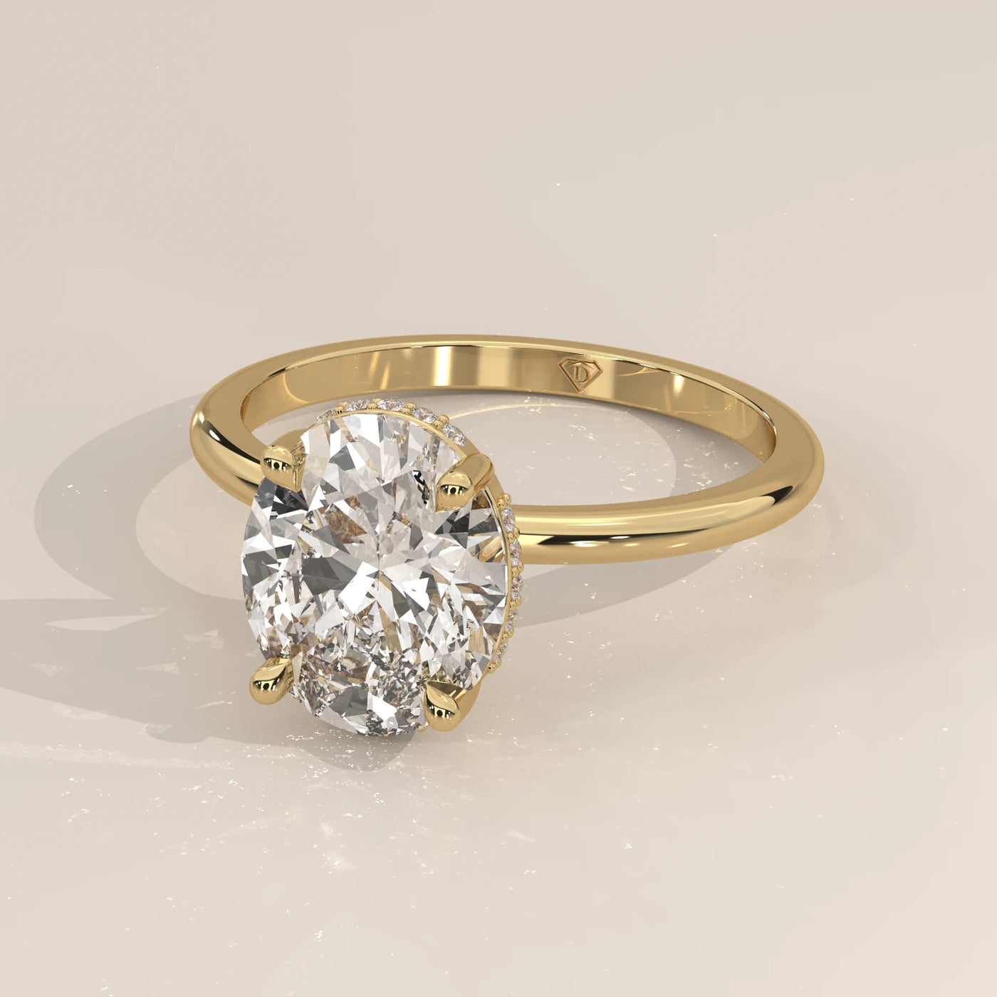 Gold ring with an oval-cut diamond and pave details.