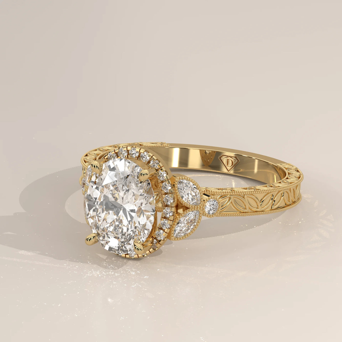 Oval diamond engagement ring with detailed band in yellow gold.