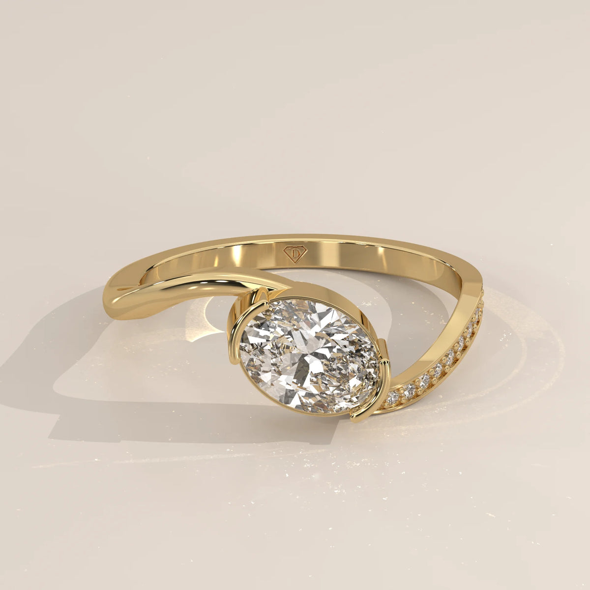 Oval Lab Grown Diamond Bypass Ring with Half Bezel and Pave Shoulder in yellow gold, shown at an angle.