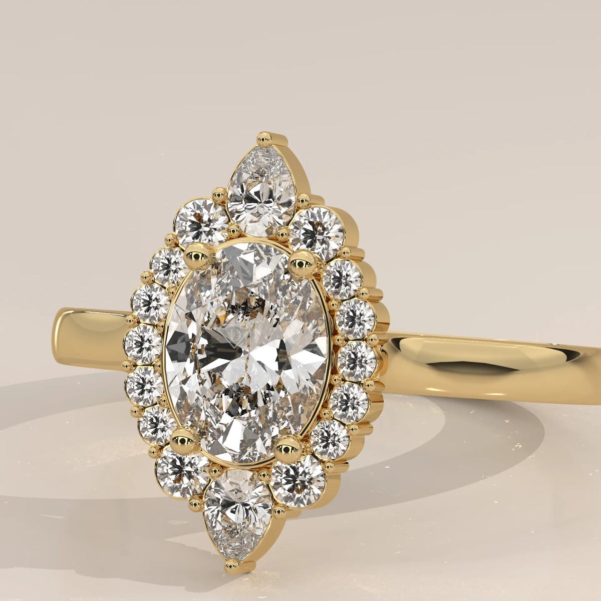 Oval Lab Grown Diamond Halo Ring with Pear Tips at Top and Base in yellow gold, shown in close-up.