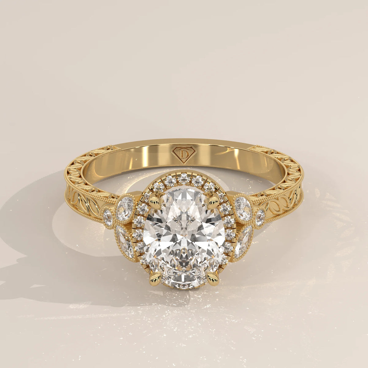 Oval diamond engagement ring with a halo of smaller diamonds in yellow gold.