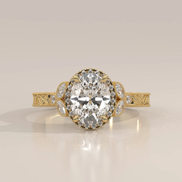 Oval diamond engagement ring with a halo of smaller diamonds in yellow gold.