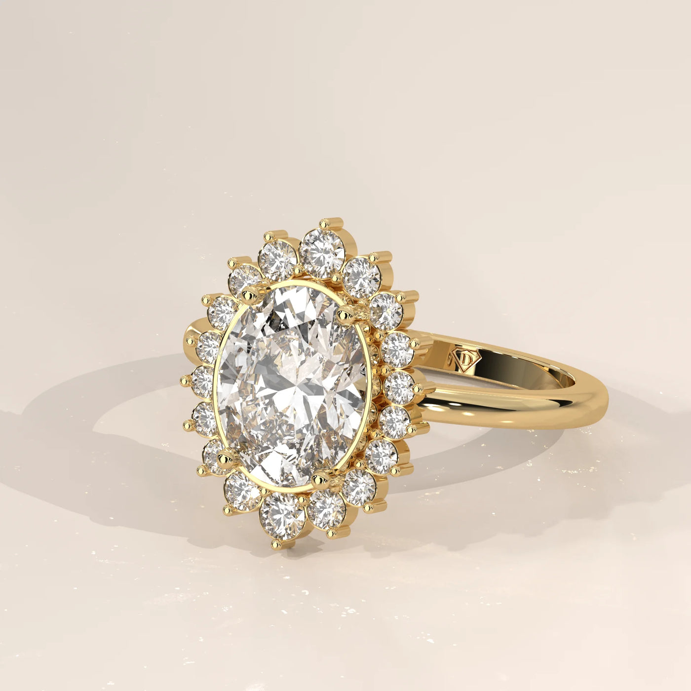 Oval diamond halo ring with baguette and round diamonds in yellow gold.