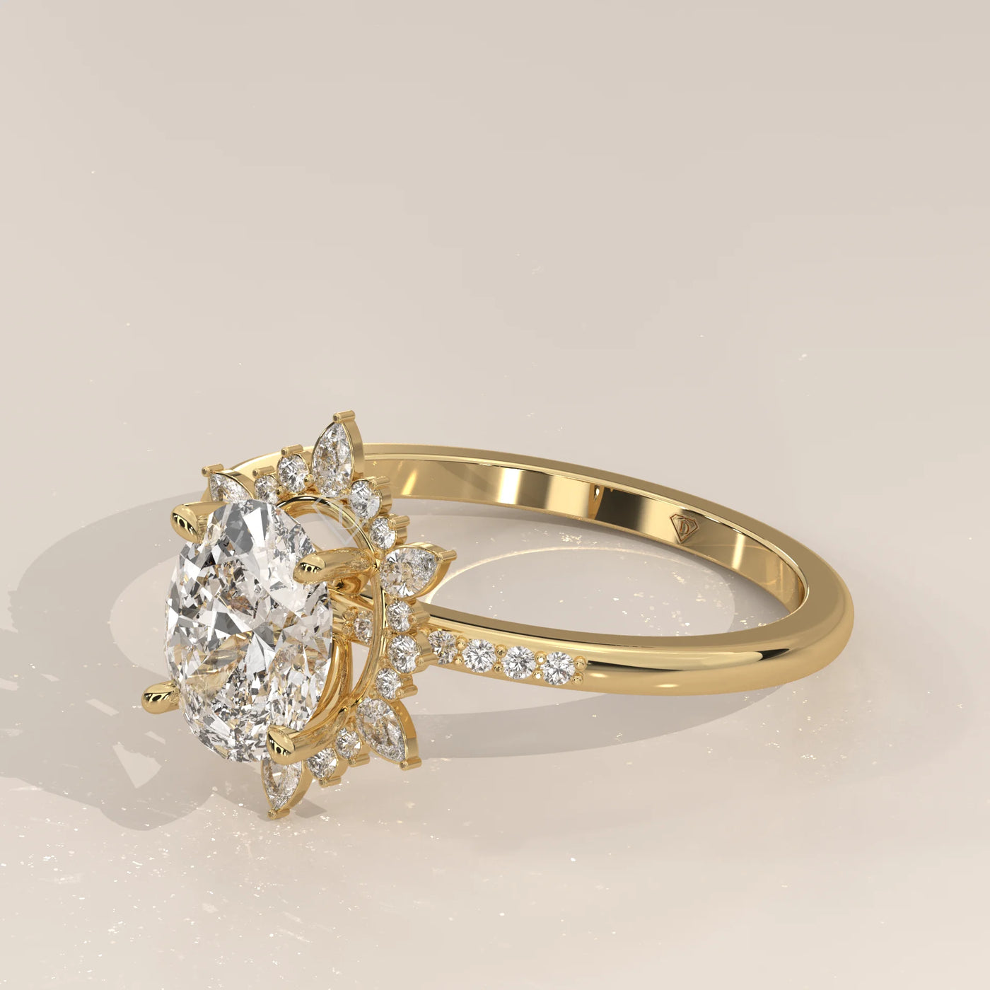 Oval diamond engagement ring with a sunburst halo and pave band in yellow gold.