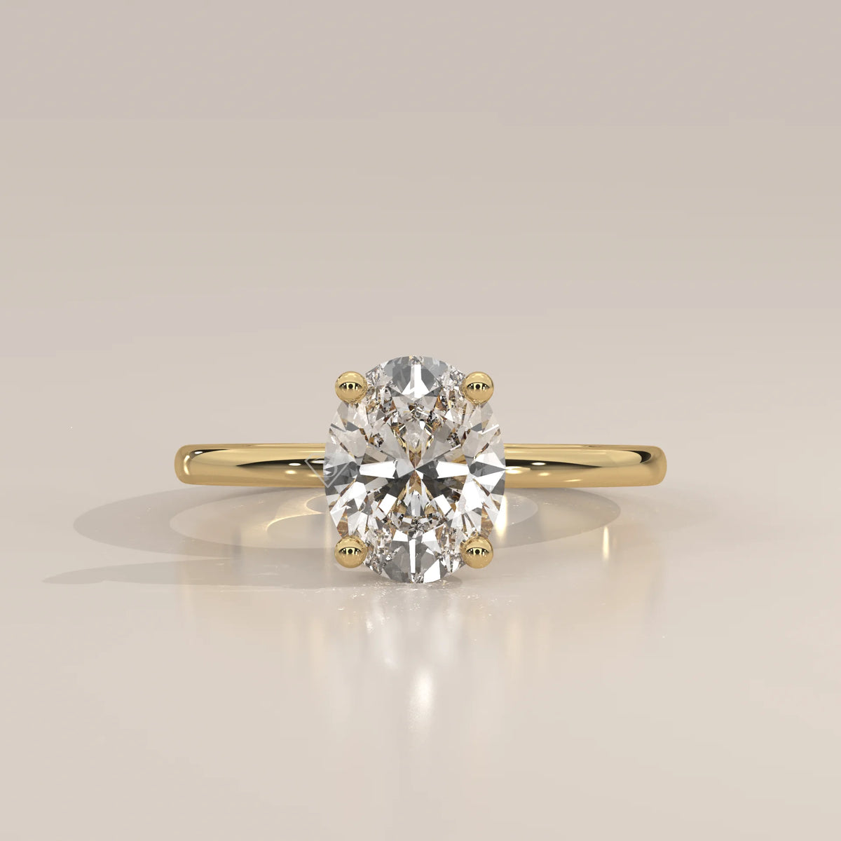 Oval Lab Grown Diamond Solitaire with Hidden Halo and Scroll Gallery in yellow gold, photographed head-on.
