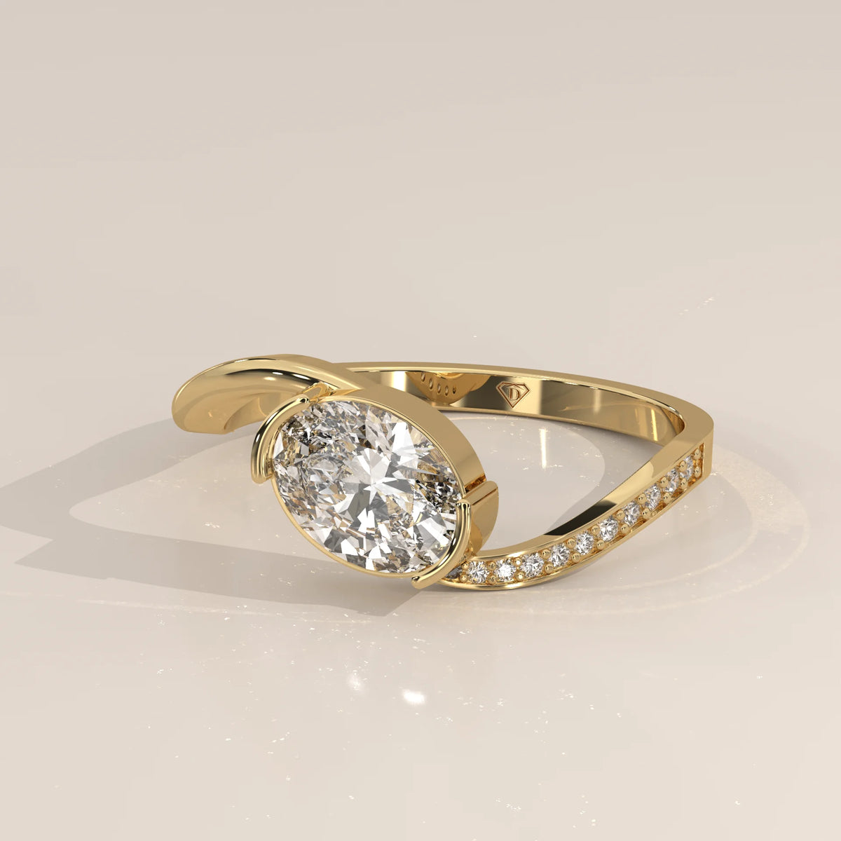 Oval Lab Grown Diamond Bypass Ring with Half Bezel and Pave Shoulder in yellow gold, shown from the side.