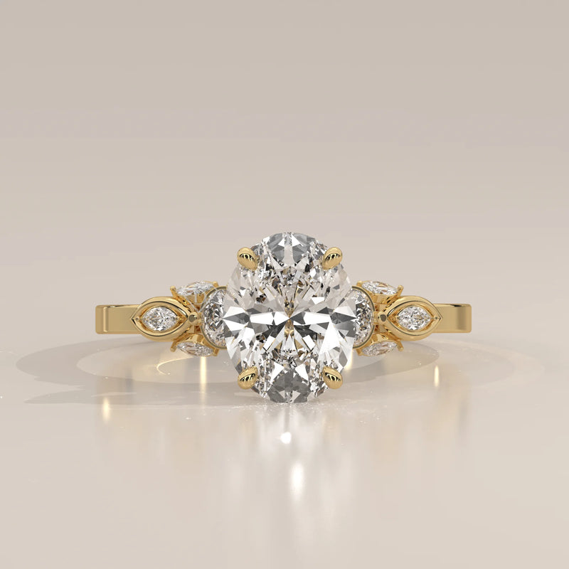 Oval diamond engagement ring with floral accents in 18k yellow gold.