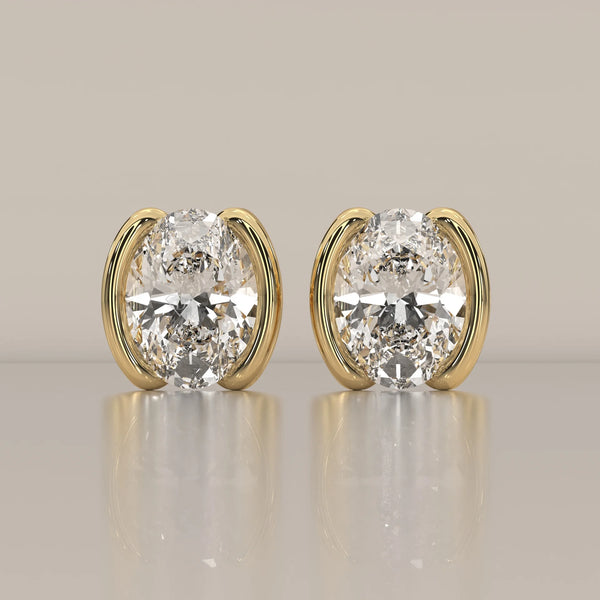 Oval Half Bezel Lab Grown Diamond Stud Earrings with Curved Bars in yellow gold, shown from the front.