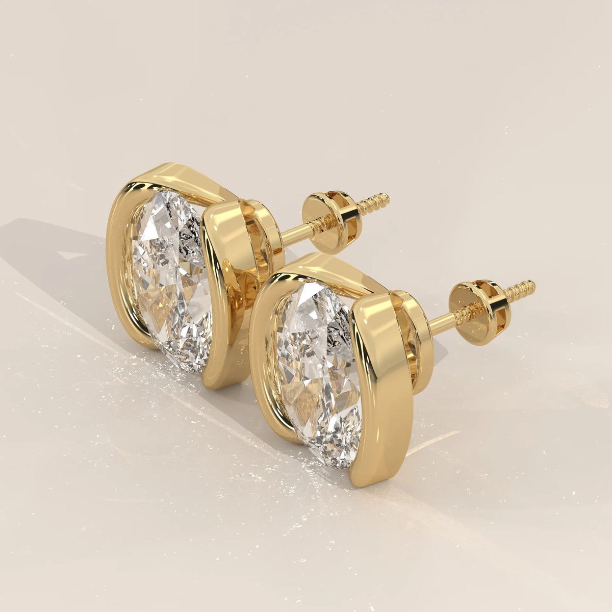 Oval Half Bezel Lab Grown Diamond Stud Earrings with Curved Bars in yellow gold, shown from the side.