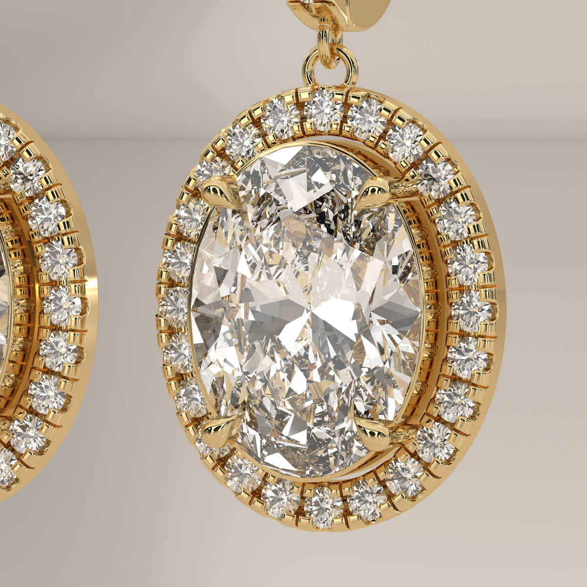 Oval Halo Lab Grown Diamond Drop Earrings with Pave Lever Back in yellow gold, front view on a plain background.