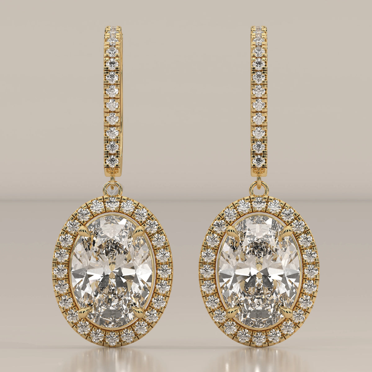 Oval Halo Lab Grown Diamond Drop Earrings with Pave Lever Back in yellow gold, shown from the front.