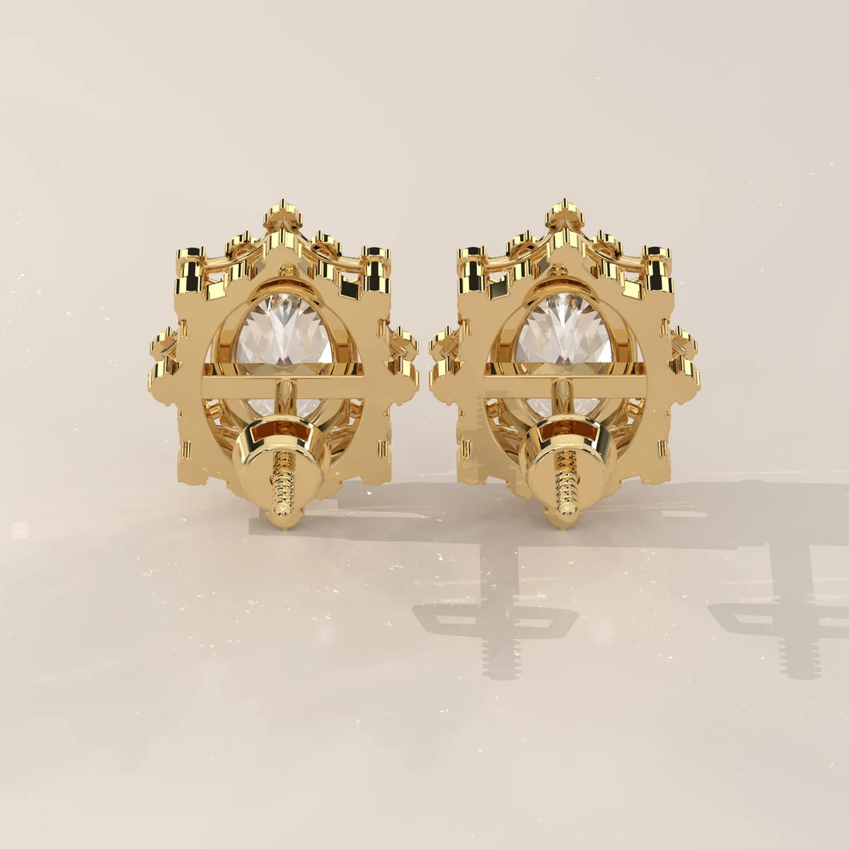 Oval Lab Grown Diamond Studs in a Snowflake Point Halo in yellow gold, shown on a plain background.