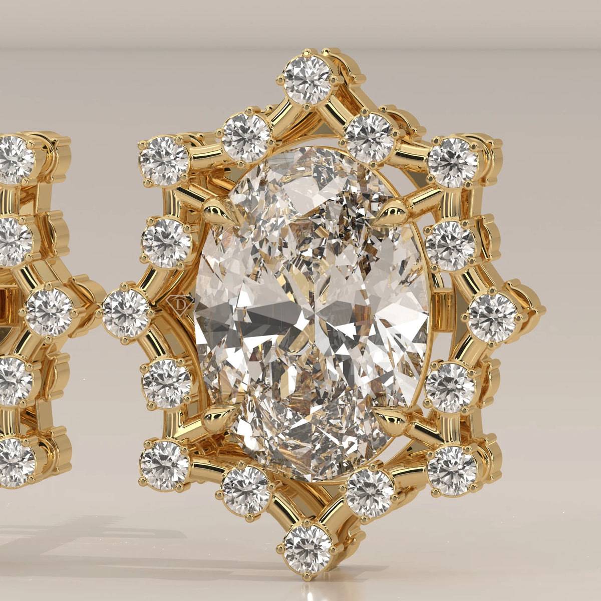 Oval Lab Grown Diamond Studs in a Snowflake Point Halo in yellow gold, photographed at a three-quarter angle.